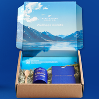 New Zealand Honey Co. wellness gift box with the lid printed with an alpine New Zealand landscape, containing a Manuka Honey jar and accessories