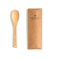 New Zealand Honey Co. bamboo Daily Spoon engraved with the brand name — accessory detail