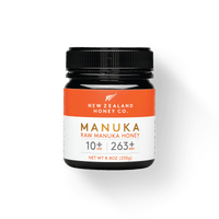 Jar of New Zealand Honey Co. Manuka Honey UMF™ 10+ MGO 263+ with orange label, 250g (8.8oz)