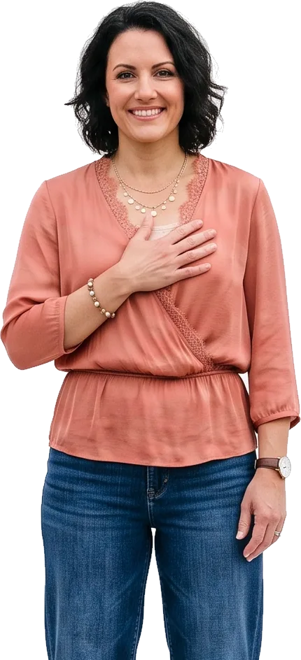 Woman with a hand resting on her chest