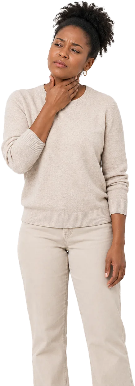 Woman in a cream sweater with her hand at her throat